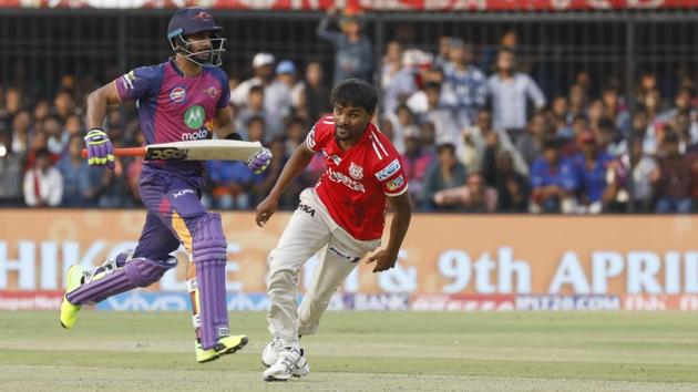 Rising Pune Supergiants’ Manoj Tiwary takes a single as Sandeep Sharma of Kings XI Punjab looks at the ball at the Holkar Stadium in Indore on Saturday. (BCCI)