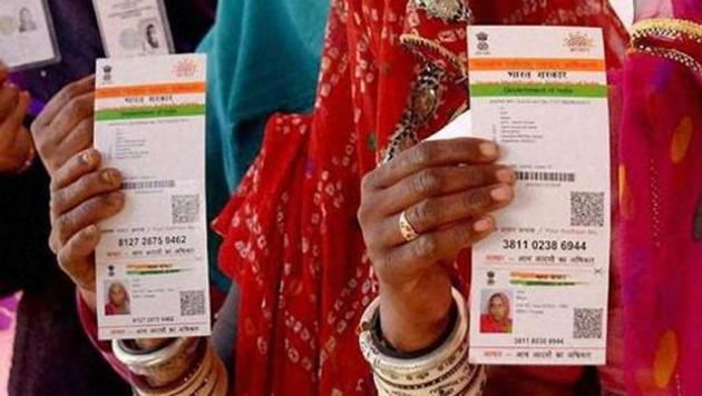 Women showing their respective Aadhaar cards.(PTI File Photo)