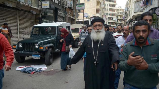 Bombs tore through two Egyptian churches in different cities as worshippers were marking Palm Sunday, killing at least 37 people and wounding around 100 in an assault claimed by the Islamic State group. (AFP)