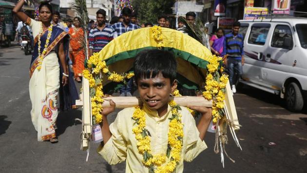The festival is observed in the Tamil month of Panguni and is celebrated in honor of Hindu god Murugan where devotees make offerings to lord Murugan with sacrificial feats which they believe keeps them away from evil spirits. (Ajit Solanki / AP)