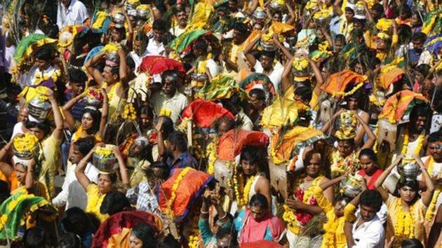 Indian Tamil Hindu devotees participate in a religious procession during Panguni Uthiram festival. (Ajit Solanki / AP)