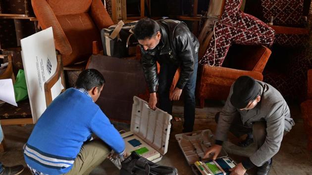 Kashmiri poll staff check electronic voting machines in Srinagar on Saturday. (AFP Photo) Kashmiri poll staff check electronic voting machines in Srinagar on Saturday. (AFP Photo)