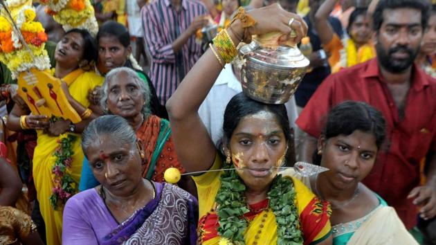 The festival is observed in the Tamil month of Panguni and is celebrated to honour the Hindu God Murugan. (ARUN SANKAR / AFP)