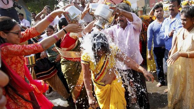Hindu devotees taking part in a procession during the festival of Panguni Uthiram in Ahmedabad on Sunday. (PTI)