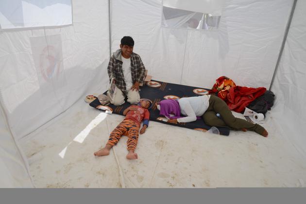 Displaced residents from nearby communities affected by the floods rest at a refugee camp on the outskirts of the northern Peruvian city of Piura, on April, 5, 2017. The "El Niño" weather phenomenon caused heavy seasonal rains since the beginning of the year, leading to overflowing rivers, flash floods and mudslides in most of the northern coastal region of Peru, and leaving 106 people dead and more than 210,000 homes damaged. In addition, the floods destroyed drinking water infrastructure and thousands of hectares of crops, as well as hundreds of kilometers of roads and bridges. (CRIS BOURONCLE / AFP)