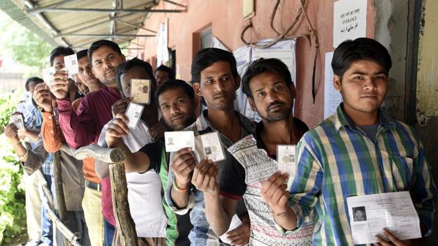 People line up to cast vote during by-election to Rajouri Garden assembly constituency in New Delhi on Sunday.(Sonu Mehta/HT Photo) People line up to cast vote during by-election to Rajouri Garden assembly constituency in New Delhi on Sunday.(Sonu Mehta/HT Photo)