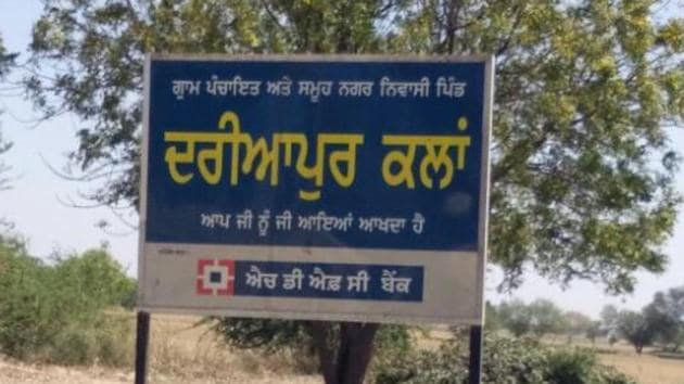 A signboard outside Dariyapur Kalan village in Mansa.(HT Photo)