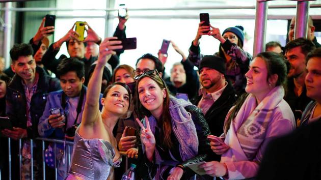 Michelle Rodriguez, who plays Letty in the film, poses for a selfie with fans at the Fate Of The Furious New York premiere. (REUTERS)