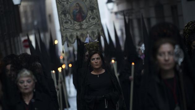 Women wearing the traditional mantilla from "Los Estudiantes" brotherhood take part in a traditional annual Holy Week procession in Madrid. Hundreds of processions took place throughout Spain during the Easter Holy Week. (Francisco Seco/AP)