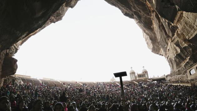 Christians pray during Palm Sunday mass inside the Cave Cathedral or St. Sama'ans Church on the Mokattam hills overlooking Cairo, Egypt. (Nariman El-Mofty/AP)