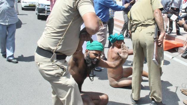 Tamil Nadu farmers today off their clothes in their demand for a drought relief package. (HT Photo)