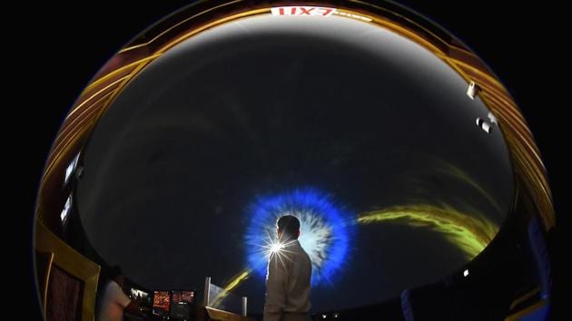 A faculty member plays an interactive program for amateur and budding astronomers at the Nehru Planetarium. (Raj K Raj/HT PHOTO)
