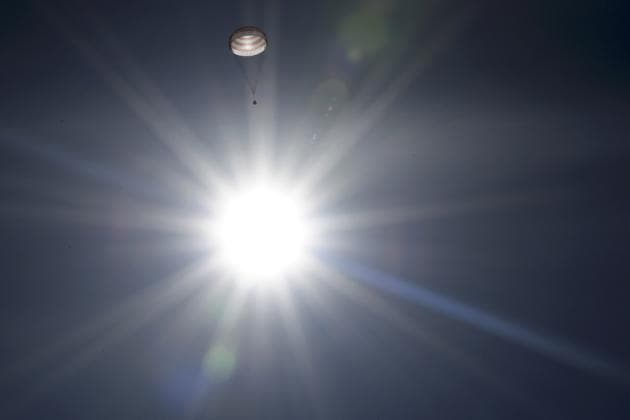 A Soyuz space capsule hangs beneath its parachute while returning Expedition 50 crewmembers Shane Kimbrough of NASA and Russian cosmonauts Sergey Ryzhikov and Andrey Borisenko to Earth in Kazakhstan on April 10, 2017. (Kirill Kudryavtsev/Pool /REUTERS)