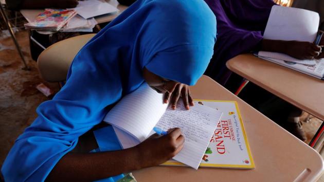 Zeinab, 14, writes in class at a school near a camp. Parts of South Sudan are already suffering famine, the first in six years. (Zohra Bensemra/REUTERS)