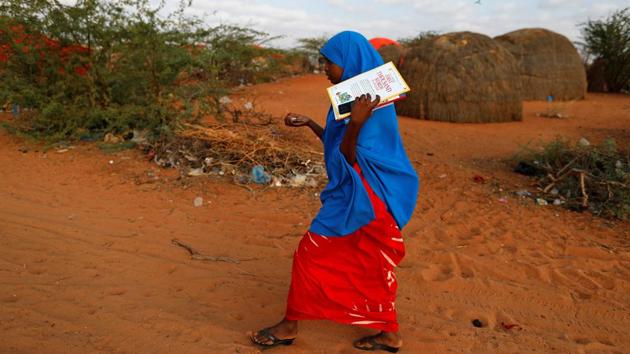 Zeinab, 14, walks to school at a camp for internally displaced people from drought hit areas in Dollow. In Somalia, the United Nations says more than half the 12 million population need aid. (Zohra Bensemra/REUTERS)