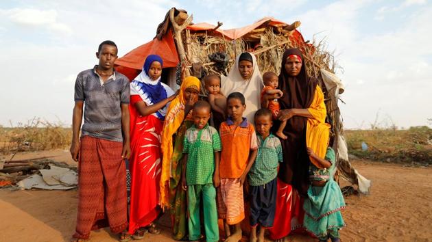 Zeinab, 14, (2nd L) poses for photograph with her family beside their shelter. Weighed against Zeinab’s dreams were the lives of 20 nieces and nephews, the sons and daughters of her three elder sisters, all married young and all widowed or divorced. There was also her careworn older brother, her gap-toothed younger sister and her middle-aged parents. (Zohra Bensemra/REUTERS)