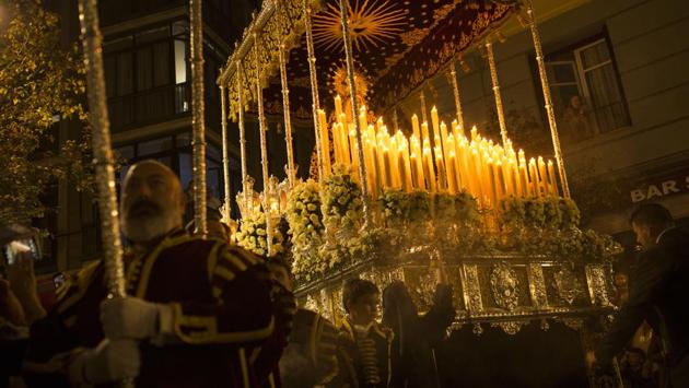 Masked penitents and acolytes from "Los Estudiantes" brotherhood take part in a traditional annual Holy Week procession in Madrid. (Francisco Seco/AP)