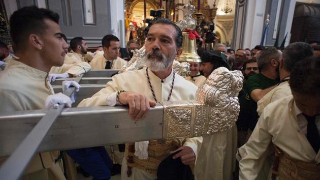 Spanish actor Antonio Banderas takes part in the 'Lagrimas y Favores' (Tears and favours) brotherhood procession. (Jorge Guerrero/AFP)