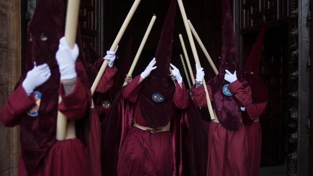 Penitents of the "Gitanos" (The Gypsy) brotherhood take part in a procession in Ronda, during the Holy Week. Christian believers around the world mark the Holy Week of Easter in celebration of the crucifixion and resurrection of Jesus Christ. (Jorege Gurrero/AFP)