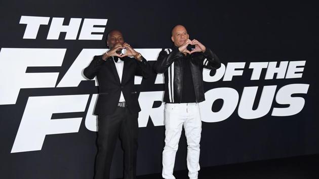 Actors Tyrese Gibson and Vin Diesel make heart gestures at the premiere of Universal Pictures' The Fate Of The Furious at Radio City Music Hall in New York City. (AFP)