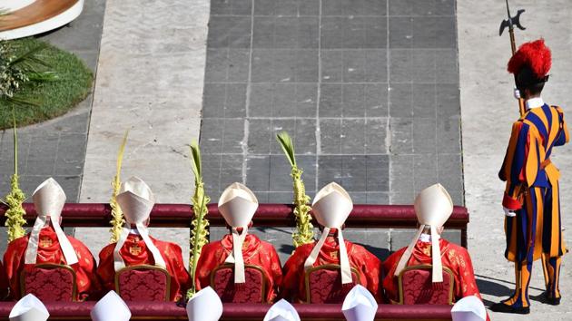 Cardinals attend the Palm Sunday mass at St Peter's square in Vatican. (Vincenzo Pinto/AFP)