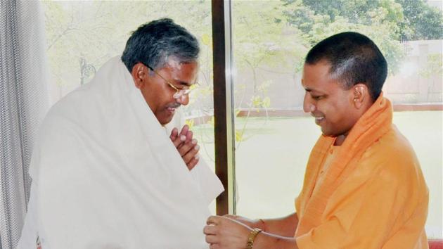 Chief ministers Yogi Adityanath of UP and Trivendra Singh Rawat of Uttarakhand — both of whom hail from Pauri Garhwal region of Uttarakhand — on April 10, soon after the BJP stormed to power in the two states. (PTI File Photo) Chief ministers Yogi Adityanath of UP and Trivendra Singh Rawat of Uttarakhand — both of whom hail from Pauri Garhwal region of Uttarakhand — on April 10, soon after the BJP stormed to power in the two states. (PTI File Photo)
