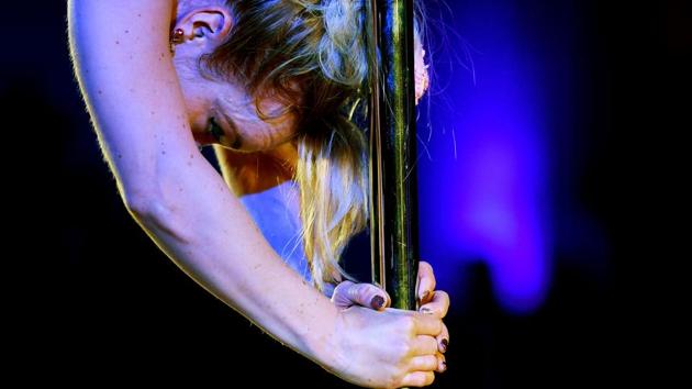 The organisation’s website states over 2,000 pole dancers compete each year in the competition series. (Mark RALSTON/AFP)