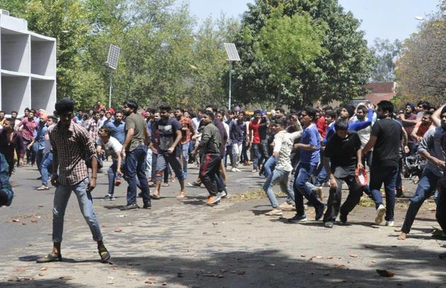 Things turned ugly at Panjab University (PU) on Tuesday as the protest against fee hike witnessed police using tear gas and students replying with stone-pelting. (Karun Sharma/HT)