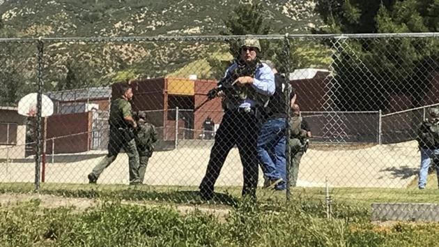 Emergency personnel respond to the shooting inside North Park Elementary School. (AP) Emergency personnel respond to the shooting inside North Park Elementary School. (AP)
