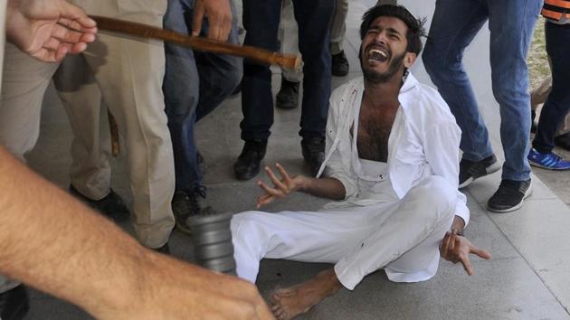 A student assaulted in the police action during a protest against fee hike at Panjab University, Chandigarh, on Tuesday, April 11. (Karun Sharma/HT)