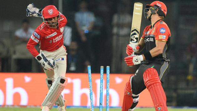 Royal Challengers Bangalore batsman Shane Watson is bowled as Kings XI Punjab wicketkeeper Wriddhiman Saha celebrates the dismissal during the 2017 Indian Premier League Twenty20 cricket match at the Holkar Stadium in Indore on Monday.(AFP)