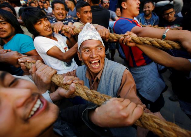The religious festival – which marks the year 2071 in the Bikram calendar - also sees locals sacrificing chickens for a statue of god-figure Lingam. (Navesh Chitrakar/REUTERS)