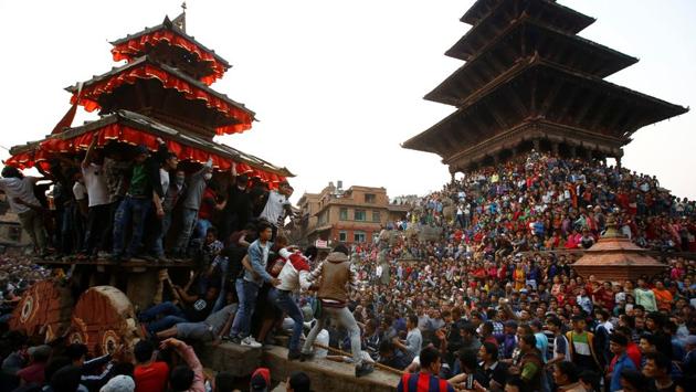 People throng the Nyatapola Temple in Bhaktapur to celebrate the 9 days long festival. (Navesh Chitrakar/REUTERS)