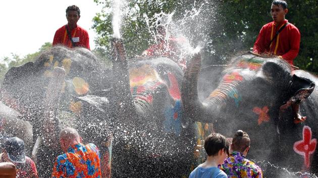 In Bangkok, Songkran is celebrated as a national holiday from April 13 to 15 . (Chaiwat Subprasom / Reuters)