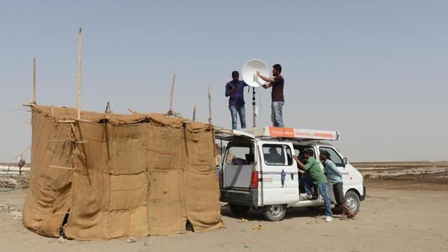 Programme co-ordinators for Agariya Heet Rakshak Manch set up an Internet-connected van for a tent school workshop for a group of children of salt pan workers in the Little Rann of Kutch. (AFP)