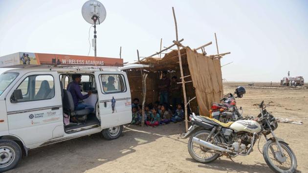 The mobile van workshops for the children in progress providing them online access. Located in a remote corner of western Gujarat, where there is no power supply, it is an out of the world experience for the kids. (AFP)
