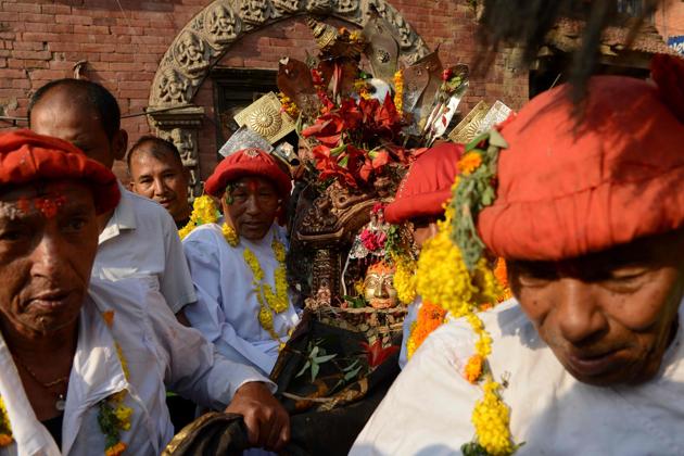 Nepalese Hindu devotees carry a statue of the Hindu god Bhairav. (Prakash Mathema/AFP)