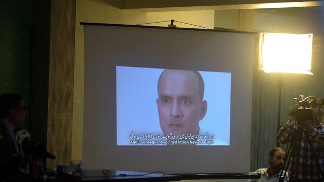 In this file photograph, Pakistani journalists watch a video showing Indian national Kulbhushan Yadav, arrested on suspicion of spying, during a press conference in Islamabad.(AFP)