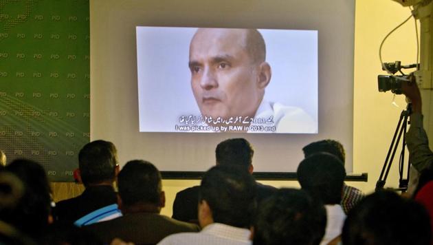 Pakistani journalists look at an image of Indian naval officer Kulbhushan Jadhav, who was arrested in March 2016, during a press conference in Islamabad. (AP/Anjum Naveed) Pakistani journalists look at an image of Indian naval officer Kulbhushan Jadhav, who was arrested in March 2016, during a press conference in Islamabad. (AP/Anjum Naveed)