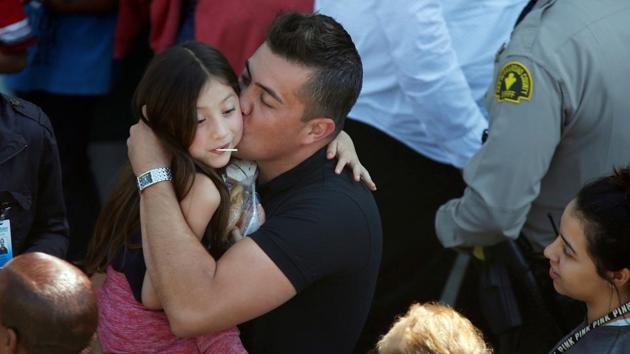 A student who was evacuated after a shooting at North Park Elementary School is embraced after groups of them were reunited with parents waiting at a high school in San Bernardino, California, U.S. A gunman entered an elementary school classroom in San Bernardino, California, and fatally shot his estranged wife, who was a teacher, and an eight-year-old student, before he killed himself, according to law enforcement. (Mario Anzuoni/REUTERS) A student who was evacuated after a shooting at North Park Elementary School is embraced after groups of them were reunited with parents waiting at a high school in San Bernardino, California, U.S. A gunman entered an elementary school classroom in San Bernardino, California, and fatally shot his estranged wife, who was a teacher, and an eight-year-old student, before he killed himself, according to law enforcement. (Mario Anzuoni/REUTERS)
