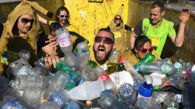 Competitors wade through plastic as they cross the obstacle during the run. (Fabrice Coffrini/ AFP)