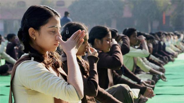 At present, yoga is part of moral studies, sports and physical education, which is mandatory for students of classes 9 to 12 in all schools affiliated to the UP Board.(File Photo) At present, yoga is part of moral studies, sports and physical education, which is mandatory for students of classes 9 to 12 in all schools affiliated to the UP Board.(File Photo)