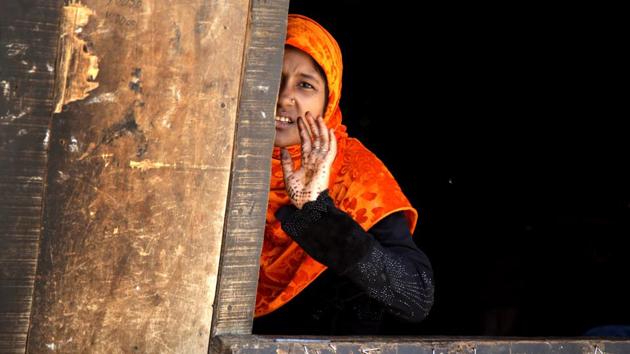 A Rohingya Muslim woman reacts to camera at a refugee camp on the outskirts of Jammu. According to news reports, Indian government plans to deport Rohingya Muslims who belong to Myanmar mostly living in Jammu and Samba districts of Jammu region. (Nitin Kanotra/HT Photo)