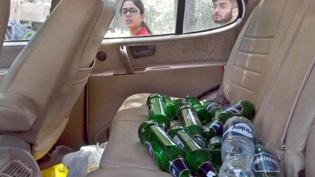 On Tuesday, a white Safari bearing Chandigarh number was spotted by the students stuck in a pathway after it smashed into the railing at night. The back seat of the car was spotted with numerous alcohol bottles.(Sameer Sehgal/HT)