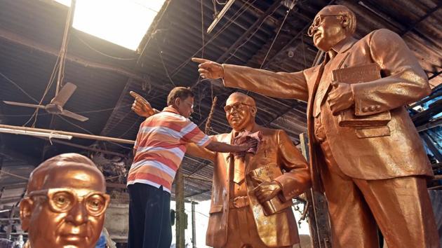 An artist cleans the idols of Dr Babasaheb Ambedkar ahead of Ambedkar Jayanti on Monday. (Pratham Gokhale/ HT Photo) An artist cleans the idols of Dr Babasaheb Ambedkar ahead of Ambedkar Jayanti on Monday. (Pratham Gokhale/ HT Photo)
