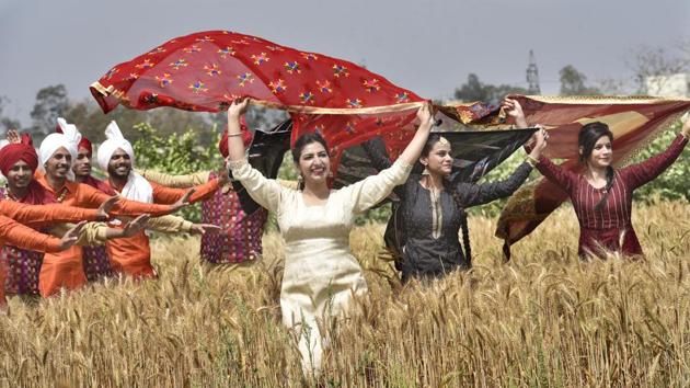 Students of Khalsa College performing traditional and Punjabi folk dance, celebrating the coming harvest season in Amritsar. (Gurpreet Singh/ht photo)