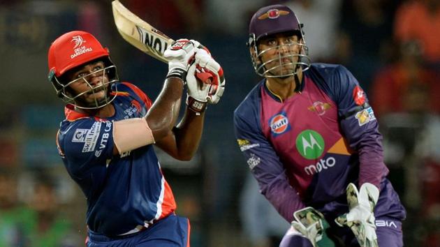 Delhi Daredevils batsman Sanju Samson plays a shot as Rising Pune Supergiant wicketkeeper Mahendra Singh Dhoni watches during the 2017 Indian Premier League Twenty20 match between Delhi Daredevils and Rising Pune Supergiant at the Maharashtra Cricket Association Stadium?in Pune on Tuesday.(AFP)