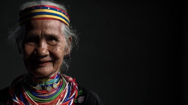 Anyu Daik, 70, from a sub-tribe of the Bidayuhs indigenous group wearing a traditional necklace called ‘Tumbih’ in Padawan in the state of Sarawak on the island of Borneo. There are currently only five Bidayuh women or ‘ring ladies’ still alive in Malaysia. The women started wearing the yellow copper rings when they were around 10 and have continuously worn them since as they are seen as a sign of beauty and prestige. According to the Bidayuh community, this is a tradition that has been passed down for generations. It is also believed that their ancestors traded with the Chinese and the copper rings were payment for goods procured from the villagers. (Mohd RASFAN / AFP)
