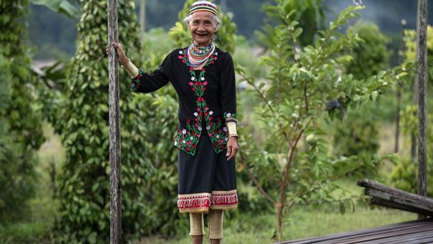 Anyu Daik, 70, smiles as she poses for a picture in Padawan in the state of Sarawak on the island of Borneo. (Mohd RASFAN / AFP)