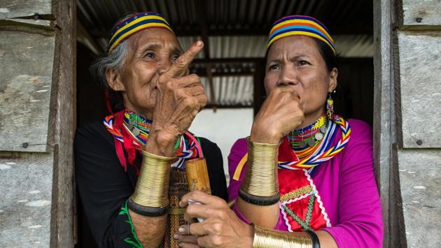 Anyu (left) and Anat decked out in traditional ‘ruyang’, which symbolises the distinctive Semban culture. (Mohd RASFAN / AFP)